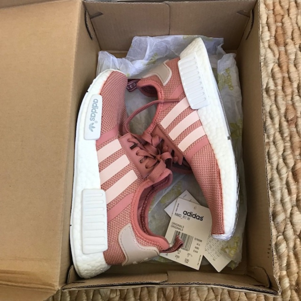 Adidas NMD R1 Salmon Raw Pink sneakers with box.